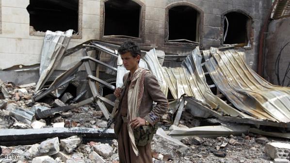 A Yemeni armed young man stands amidst the debris of a house destroyed in an air-strike by the Saudi-led coalition in the capital Sanaa on July 6, 2015. Saudi-led warplanes have bombed the headquarters of the Yemeni party headed by former president Ali Abdullah Saleh, who is allied to Shiite Huthi insurgents, according to the party. AFP PHOTO / MOHAMMED HUWAIS (Photo credit should read MOHAMMED HUWAIS/AFP/Getty Images)