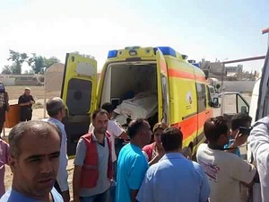 Coffins of migrants and of Aylan Kurdi (also know as Aylan Shenu), a three-year-old boy whose drowning off Turkey, are seen in an ambulance during a funeral ceremony in Kobane, on September 4, 2015 in Sanliurfa. "Aylan Shenu, his brother, and his mother were buried today in Kobane in front of a large crowd. Everyone was very sad and crying," said local journalist Mustefa Ebdi, who attended the funeral service. AFP PHOTO / STRINGER