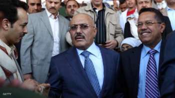 Former Yemeni president Ali Abdullah Saleh (L) and Yemen's Minister of Communications Ahmed Bin Daghr (R) attend celebrations on the occasion of the first anniversary of the handover of power in Sanaa on February 27, 2013. Saleh stepped down after 33-years at the helm in February 2011 and formally handed power to his then deputy, Abdrabuh Mansur Hadi. AFP PHOTO/ MOHAMMED HUWAIS (Photo credit should read MOHAMMED HUWAIS/AFP/Getty Images)